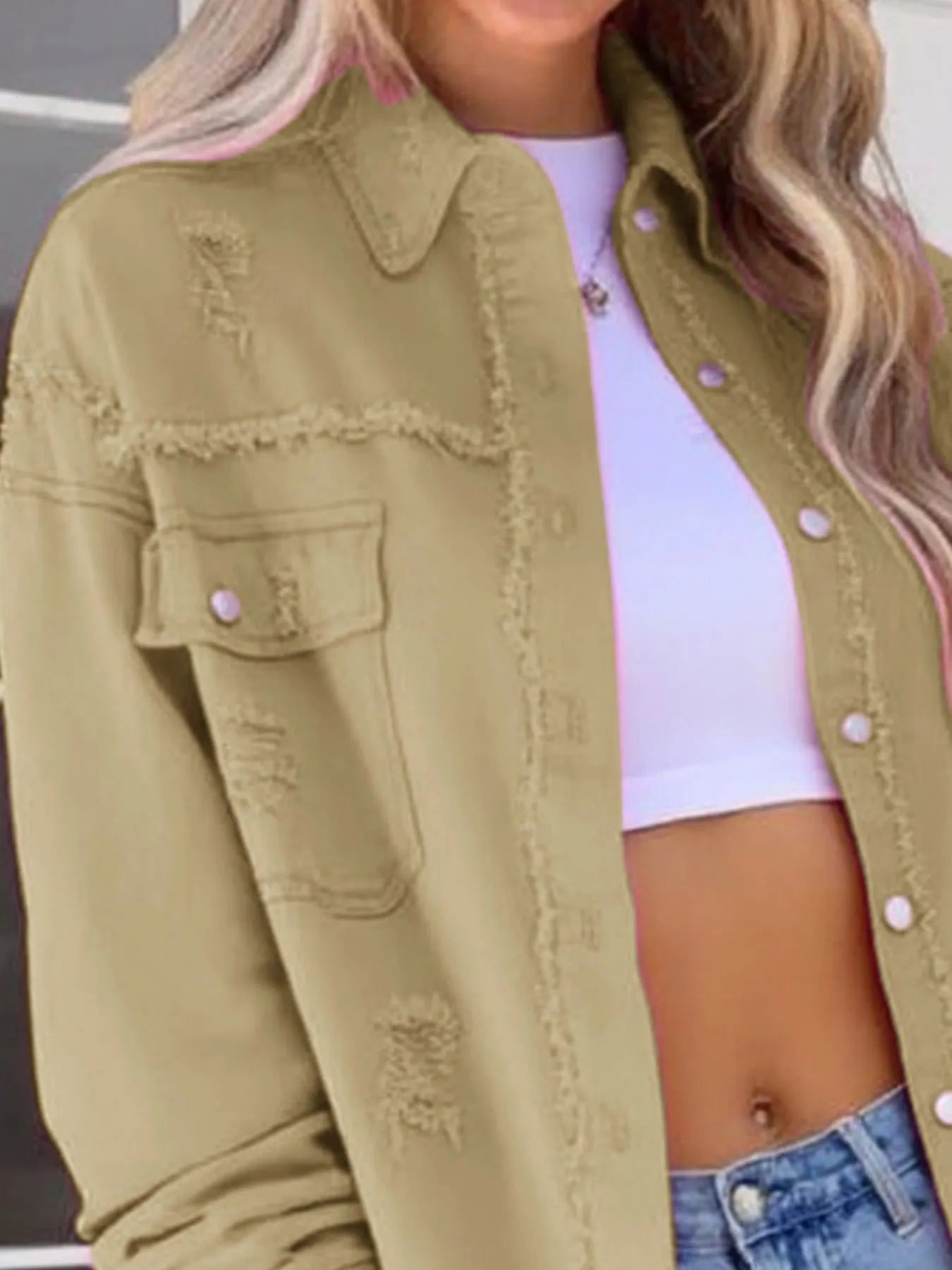 Distressed Denim Jacket with Frayed Edges.